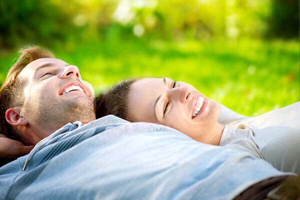 Couple lying in grass